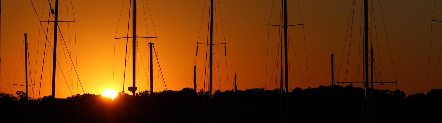 sail boats at sunset
